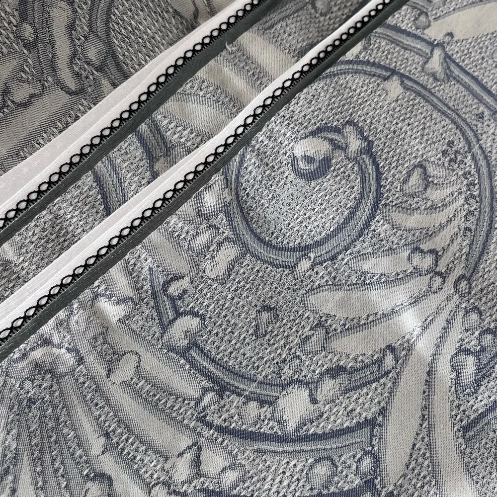 A pair of standard Yves Delorme pillow shams.
